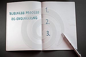 Word writing text Business Process Re Engineering. Business concept for the analysis and design of workflows Checkered