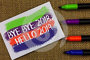 Word writing text Bye Bye 2018 Hello 2019. Business concept for Starting new year Motivational message 2018 is over Colorful waves