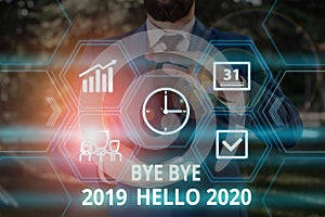 Word writing text Bye Bye 2019 Hello 2020. Business concept for Starting new year Motivational message 2019 is over Male