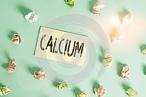 Word writing text Calcium. Business concept for fifth most abundant element in the human body Silverwhite metal Colored crumpled
