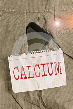Word writing text Calcium. Business concept for fifth most abundant element in the human body Silverwhite metal Smartphone device
