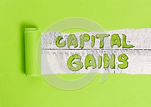 Word writing text Capital Gains. Business concept for Bonds Shares Stocks Profit Income Tax Investment Funds