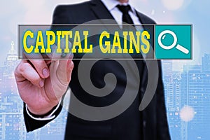 Word writing text Capital Gains. Business concept for Bonds Shares Stocks Profit Income Tax Investment Funds