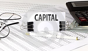 Word writing text CAPITAL on white sticker on chart background. Business concept