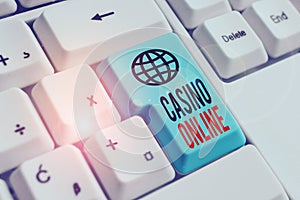 Word writing text Casino Online. Business concept for Computer Poker Game Gamble Royal Bet Lotto High Stakes White pc keyboard