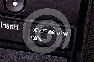 Word writing text Catching Bugs Laptop Screen. Business concept for Computer system protection safety antivirus Keyboard