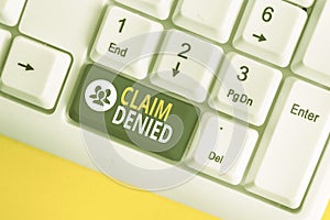 Word writing text Claim Denied. Business concept for Requested reimbursement payment for bill has been refused White pc