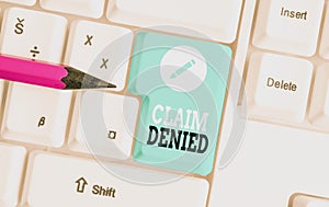 Word writing text Claim Denied. Business concept for Requested reimbursement payment for bill has been refused White pc