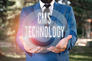 Word writing text Cms Technology. Business concept for programs that are used to create and analysisage digital content Man with photo