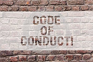 Word writing text Code Of Conduct. Business concept for Ethics rules moral codes ethical principles values respect Brick
