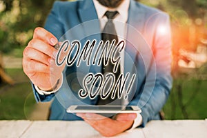 Word writing text Coming Soon. Business concept for event or action that will happen after really short time Businessman