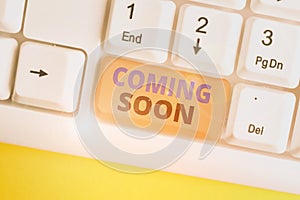 Word writing text Coming Soon. Business concept for something is going to happen soon or after a short time White pc