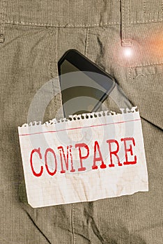 Word writing text Compare. Business concept for Estimate Measure Note the similarities dissimilarities between Smartphone device photo