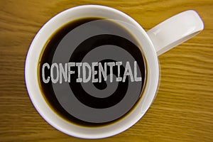 Word writing text Confidential. Business concept for Agreements between two parties are private and protected written on Black Tea