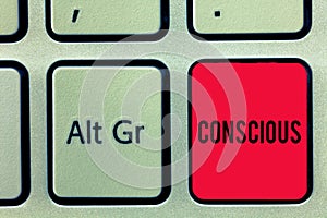 Word writing text Conscious. Business concept for aware of and responding to ones surroundings using his senses Keyboard