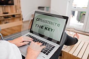 Word writing text Consistency Is The Key. Business concept for by Breaking Bad Habits and Forming Good Ones woman laptop