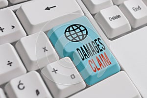 Word writing text Damages Claim. Business concept for Deanalysisd Compensation Litigate Insurance File Suit White pc