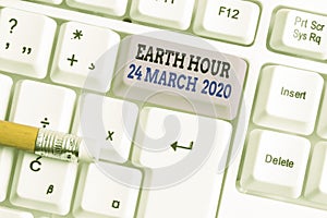 Word writing text Earth Hour 24 March 2020. Business concept for Celebrate Sustainability Save the Planet Lights Off