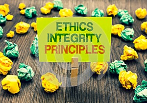 Word writing text Ethics Integrity Principles. Business concept for quality of being honest and having strong moral Clothespin hol