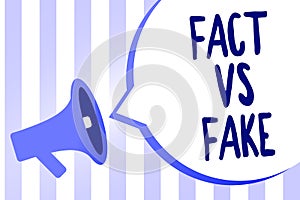 Word writing text Fact Vs Fake. Business concept for Rivalry or products or information originaly made or imitation Megaphone loud photo