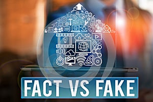 Word writing text Fact Vs Fake. Business concept for Rivalry or products or information originaly made or imitation. photo