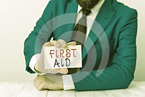 Word writing text First Aid. Business concept for Practise of healing small cuts that no need for medical training Man