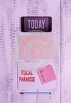 Word writing text Fiscal Paradise. Business concept for The waste of public money is a great concern topic Envelop smartphone