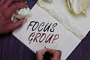 Word writing text Focus Group. Business concept for people assembled to participate in discussion about something Man holding mark
