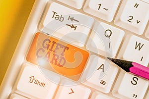 Word writing text Gift Card. Business concept for A present usually made of paper that contains your message White pc