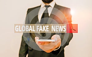 Word writing text Global Fake News. Business concept for False information Journalism Lies Disinformation Hoax Male