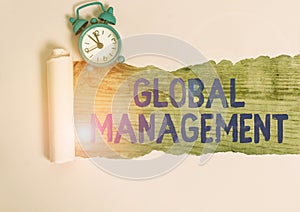 Word writing text Global Management. Business concept for way an organization analysis its business internationally Alarm clock