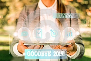 Word writing text Goodbye 2019. Business concept for express good wishes when parting or at the end of last year Female