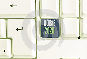 Word writing text Goodbye 2020. Business concept for New Year Eve Milestone Last Month Celebration Transition White pc photo