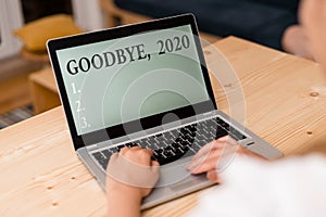 Word writing text Goodbye 2020. Business concept for New Year Eve Milestone Last Month Celebration Transition woman photo