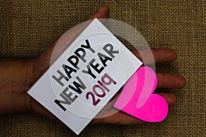 Word writing text Happy New Year 2019. Business concept for Greeting Celebrating Holiday Fresh Start Best wishes Human hand touche