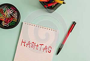 Word writing text Hashtag. Business concept for a word or phrase preceded by a hash sign Type of metadata tag Notebook and writing