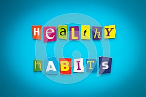 A word writing text - healthy habits - from cut letters on a blue background. Headline, card, banner with inscription. Psychologic photo