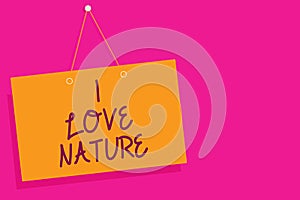 Word writing text I Love Nature. Business concept for Enjoy the natural environment Preservation Protect ecosystem Orange board wa