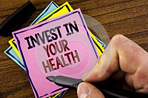 Word writing text Invest In Your Health. Business concept for Spend money in personal healthcare Preventive Tests written by Man o