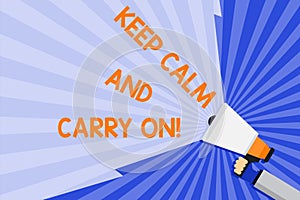Word writing text Keep Calm And Carry On. Business concept for slogan calling for persistence face of challenge Hand