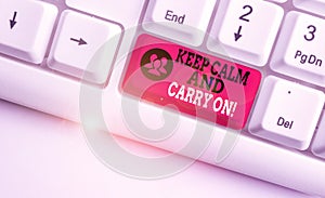 Word writing text Keep Calm And Carry On. Business concept for slogan calling for persistence face of challenge White pc