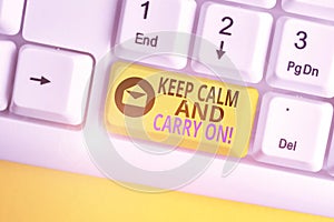 Word writing text Keep Calm And Carry On. Business concept for slogan calling for persistence face of challenge White pc