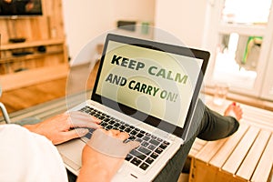 Word writing text Keep Calm And Carry On. Business concept for slogan calling for persistence face of challenge woman