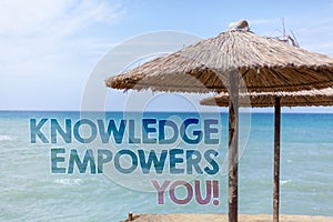 Word writing text Knowledge Empowers You Call. Business concept for Education responsible to achieve your success Blue beach water