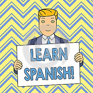 Word writing text Learn Spanish. Business concept for gain or acquire knowledge of speaking and writing Spanish Smiling