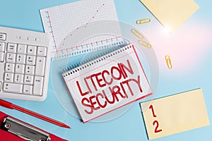 Word writing text Litecoin Security. Business concept for peertopeer cryptocurrency and opensource software Paper blue desk