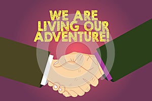 Word writing text We Are Living Our Adventure. Business concept for Exploring the world traveling life experience Hu