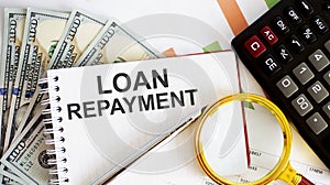 Word writing text Loan Repayment . Business concept with chart, dollars and office tools
