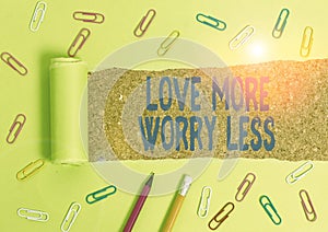 Word writing text Love More Worry Less. Business concept for Have a good attitude motivation be lovable enjoy life