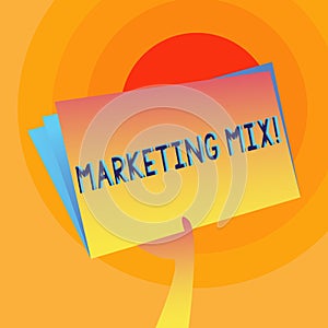 Word writing text Marketing Mix. Business concept for Actions to promote brand product in market Hand Holding and